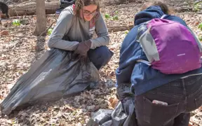 Students pick up glass and trash on the Bent Twig Trails on the 2nd Clean up and Weed Wrangle on the Trails Day.