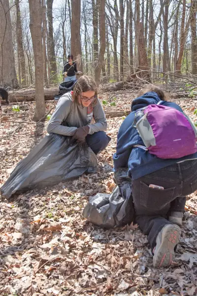 Students pick up glass and trash on the Bent Twig Trails on the 2nd Clean up and Weed Wrangle on the Trails Day.