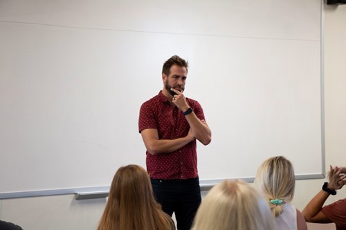 Zac talking to students