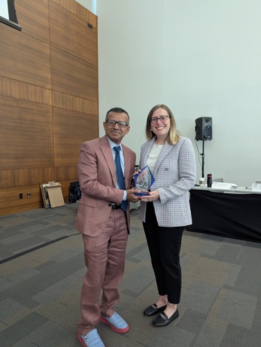 Dean presenting Meggie with her award at Board of Advisors Spring Meeting