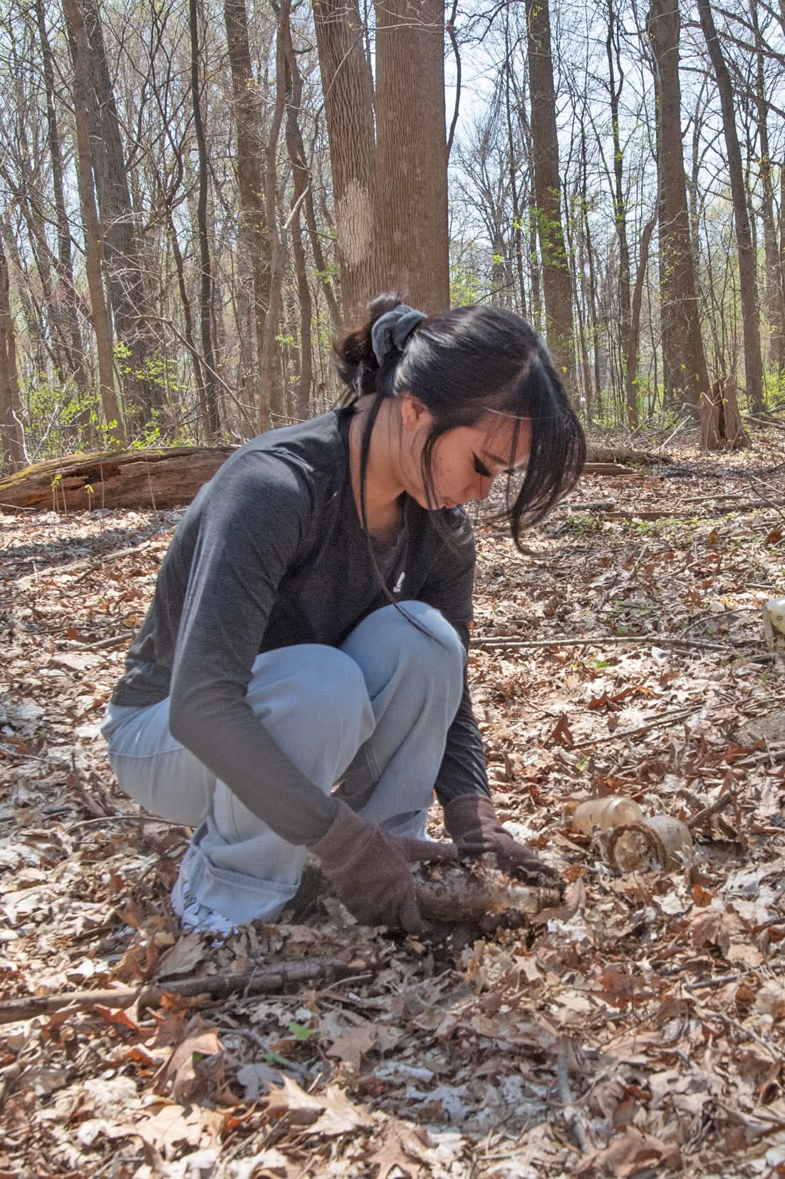 Students clean up trash and and old bottles from the 2nd Trail Clean Up Weed Wrangle on the Bent Twig Trails.