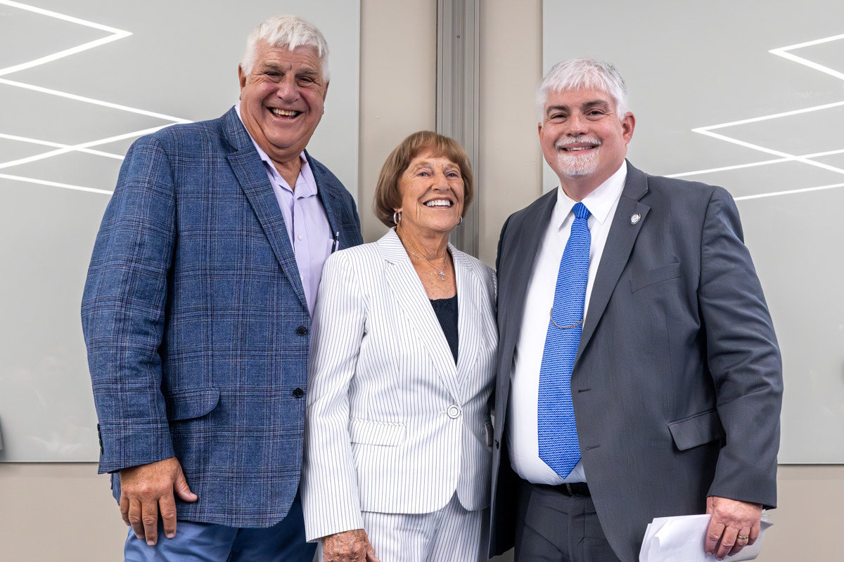 From left, David Coudret (son); Dr. Nadine Coudret; and Steven J. Bridges, USI President.