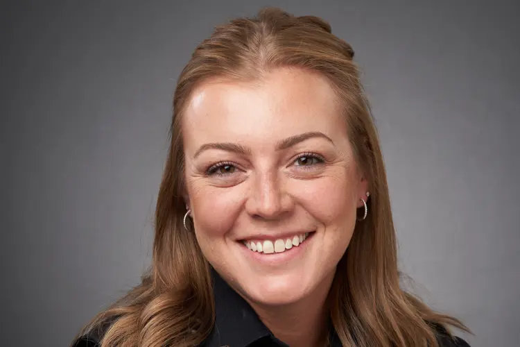 Professional portrait of USI criminal justice alumna Taylor Merriss