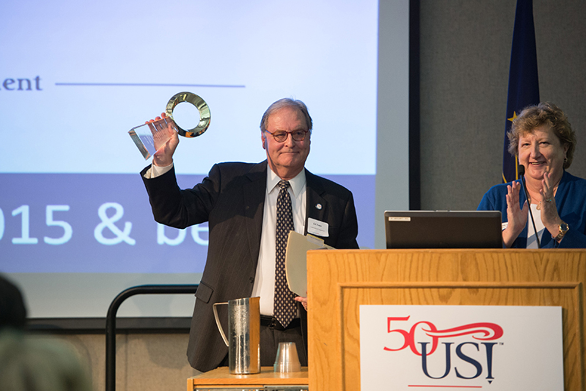 Ed Jones receives the first M. Edward Jones Engagement Award presented by Linda Cleek, executive director of Lifelong Learning in Outreach and Engagement.