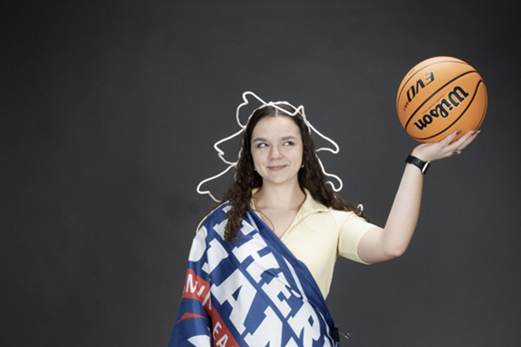 A member of the homecoming court is decked out like the Statue of Liberty for one of her homecoming photos. 