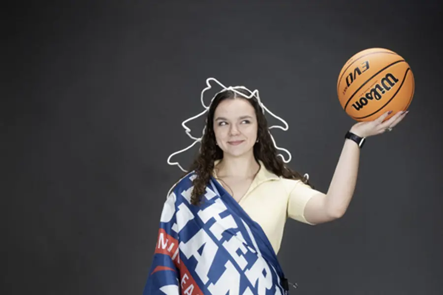 A member of the homecoming court is decked out like the Statue of Liberty for one of her homecoming photos. 