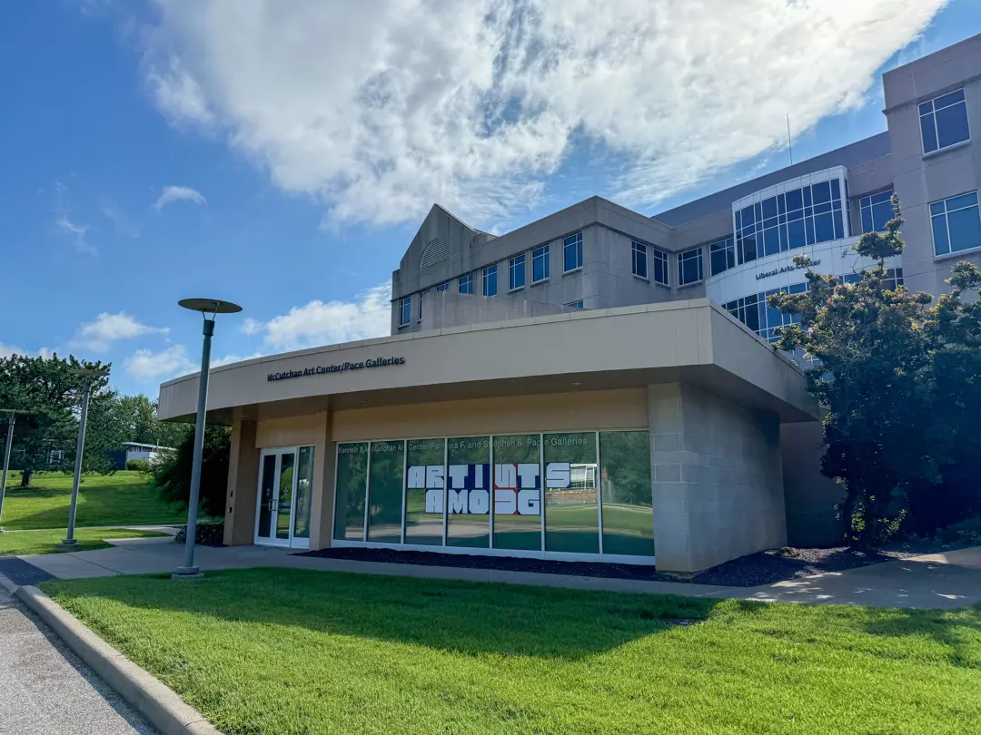 Exterior view of the McCutchan Art Center & Pace Galleries, with the words "Artists Among" painted in the window