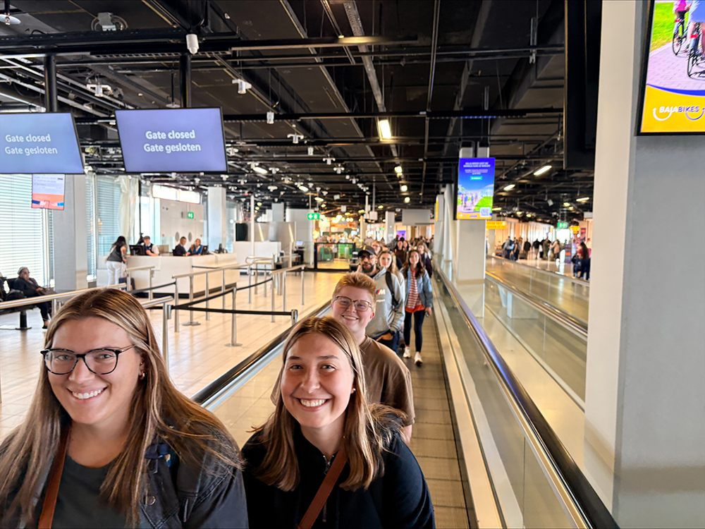 Students walking in airport terminal