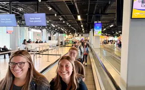 Students walking in airport terminal