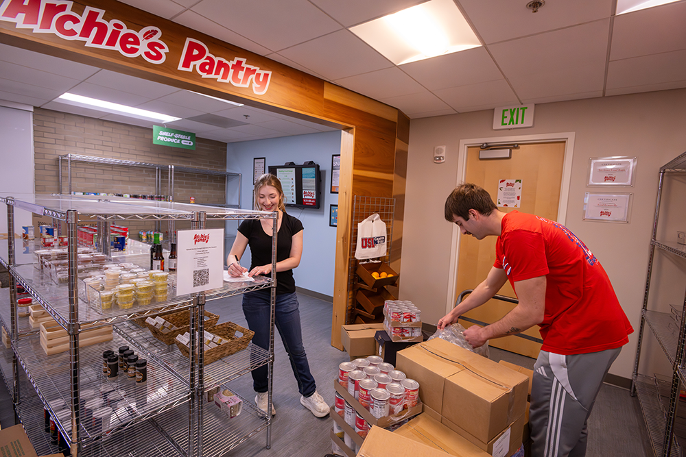 Photo of students stocking the pantry