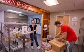 Photo of students stocking the pantry