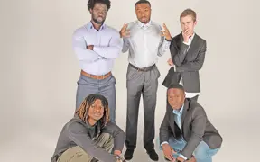 Five members of the Collegiate Men of Distinction strike a pose in the photo studio