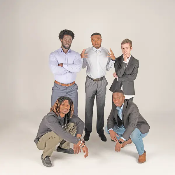 Five members of the Collegiate Men of Distinction strike a pose in the photo studio