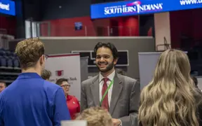 A computer science major talks with a recruiter at one of two USI Career Fairs. 