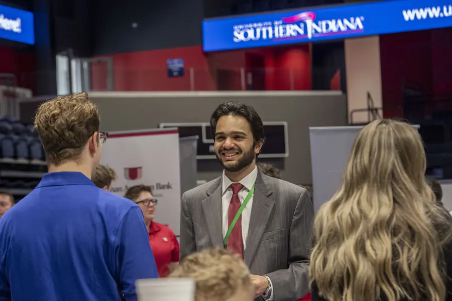 A computer science major talks with a recruiter at one of two USI Career Fairs. 