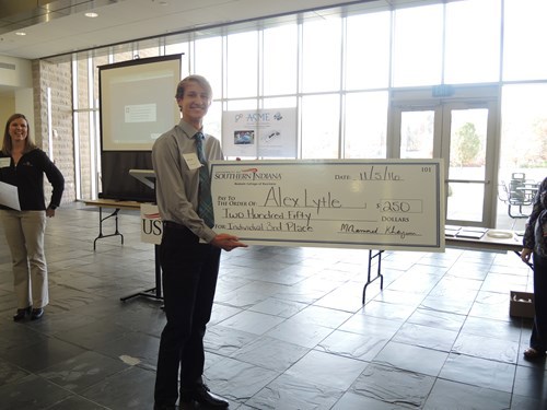 Alex holding his check