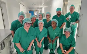 Healthcare students wearing green scrubs at hospital in Germany