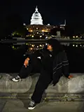 Alexander Mendoza poses casually in front of the U.S. Capitol building at night