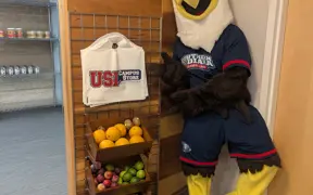 Archie Eagle standing inside the door of food pantry