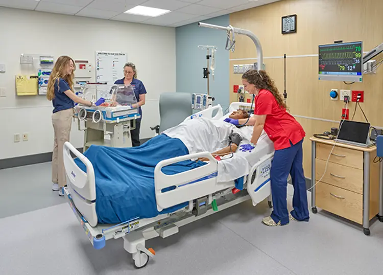 Nursing students in clinical simulation center room