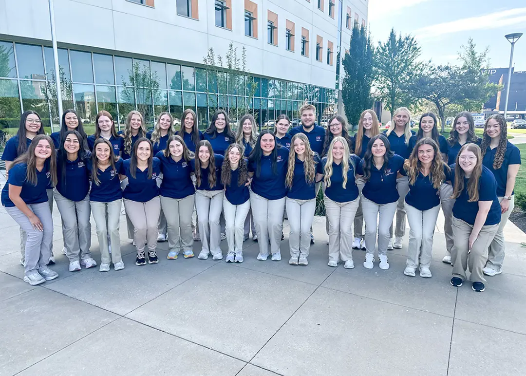 OTA Class of 2026 pose for a group photo in matching attire
