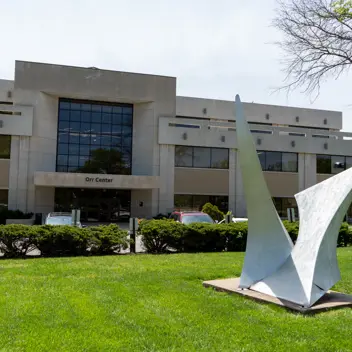 Large abstract sculpture on the lawn in front of the Orr Center building