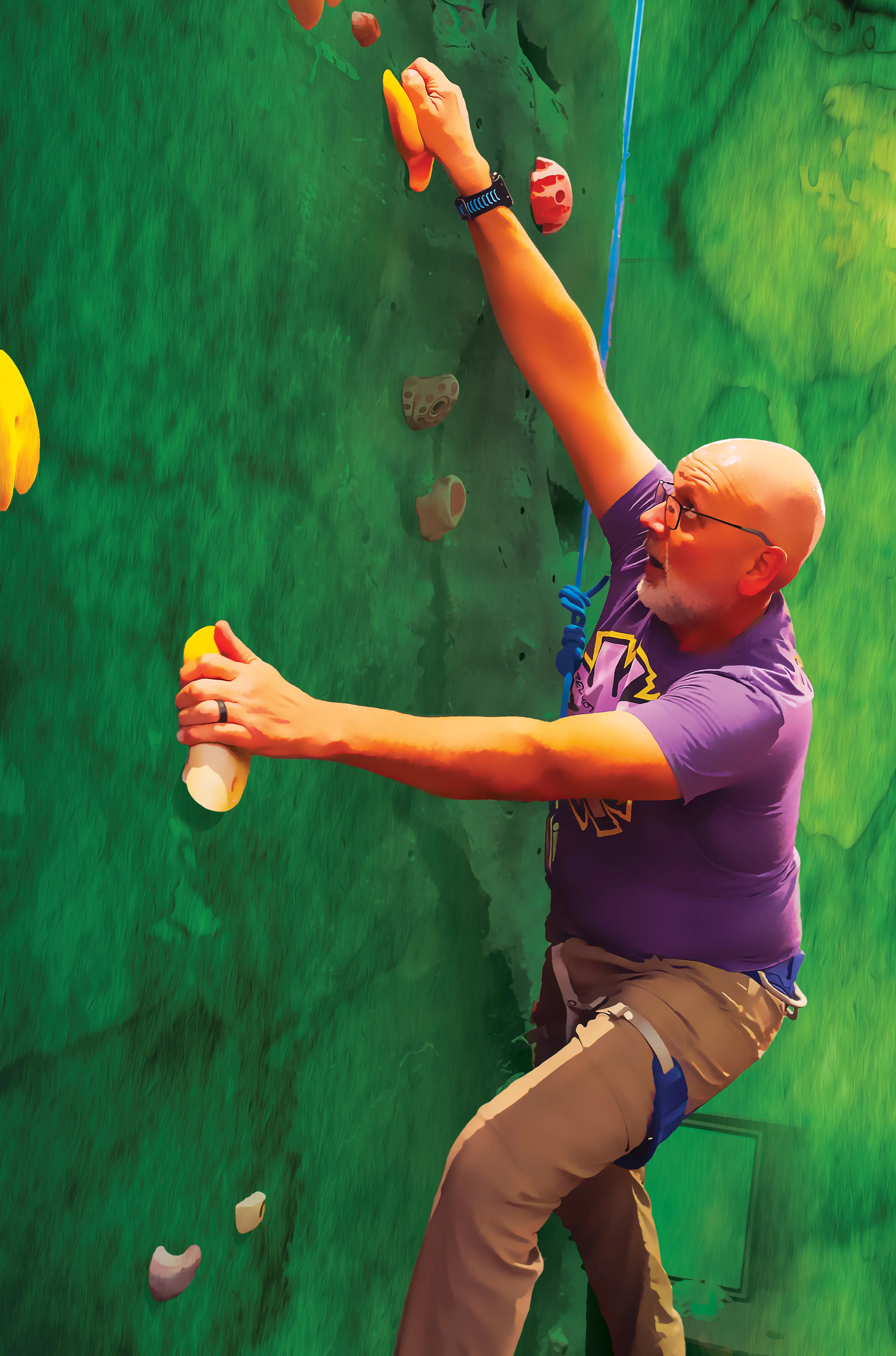 Green colorized image of Gober wearing a harness and reaching for a hold while scaling a rock climbing wall.