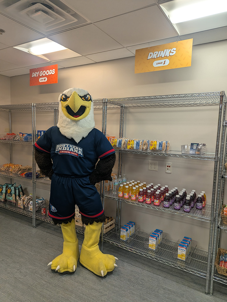 Archie Eagle standing in front of pantry shelves