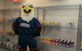 Archie Eagle standing in front of pantry shelves