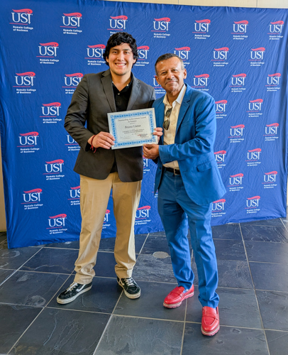 Dean handing Bruno his certificate
