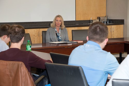 Miller talks to students
