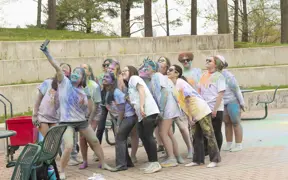 Covered in colorful cornflour dust, students take a selfie during USI's Holi celebration held in the spring. 