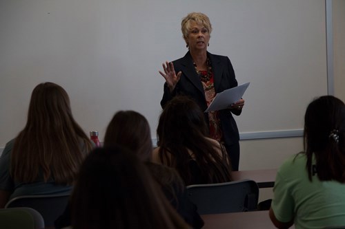 Giles talking to students