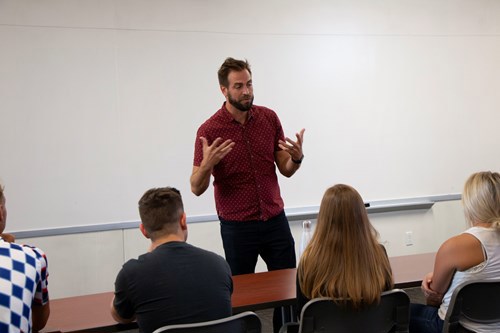 Zac talking to students