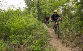 Members of the Evansville community enjoy the many mountain bike trails on campus.