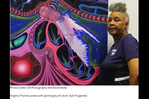 Virginia Thomas next to a painting.