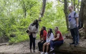Students admire the sandstone cliffs on the south east end of the trails. 