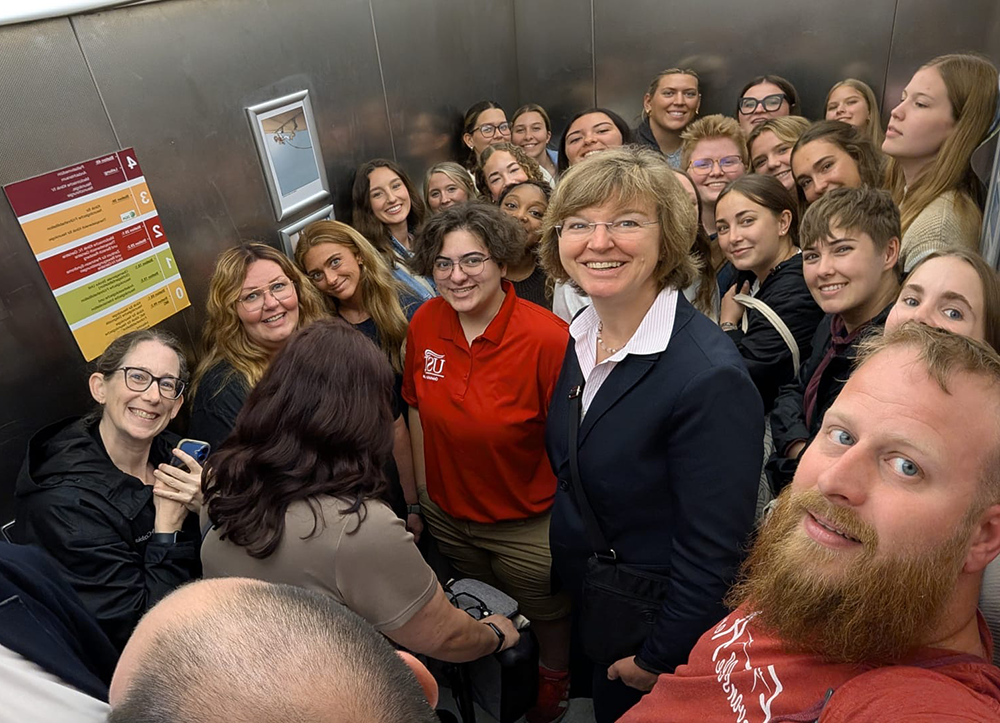 Selfie photo of students and faculty on elevator