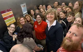 Selfie photo of students and faculty on elevator