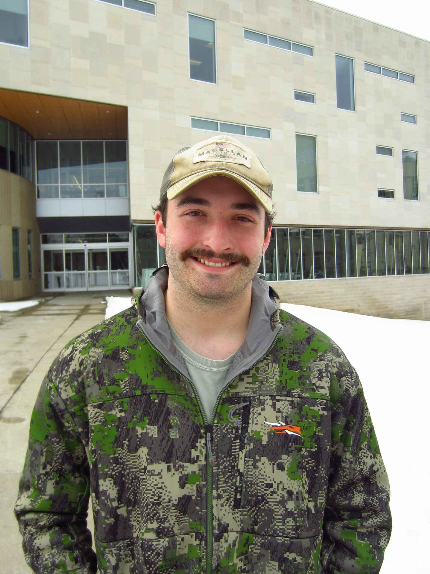 Braden Salsbury standing in front of the Business and Engineering Center