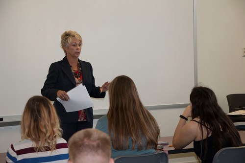 Giles talking to students