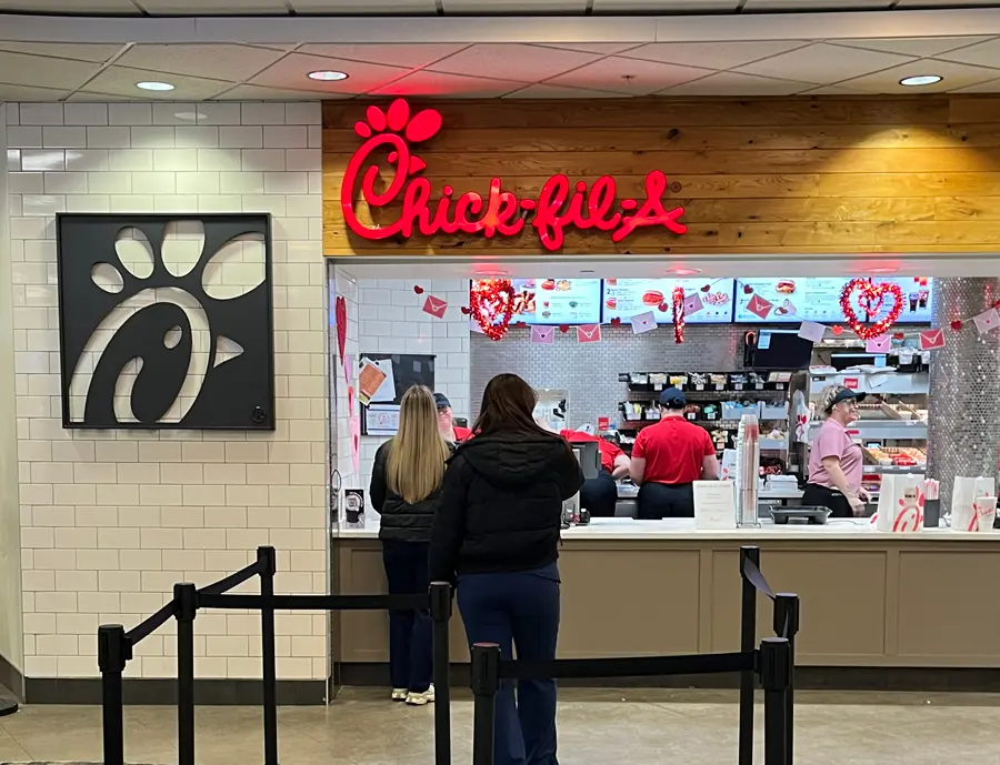 Students ordering food at the Chic fil A counter