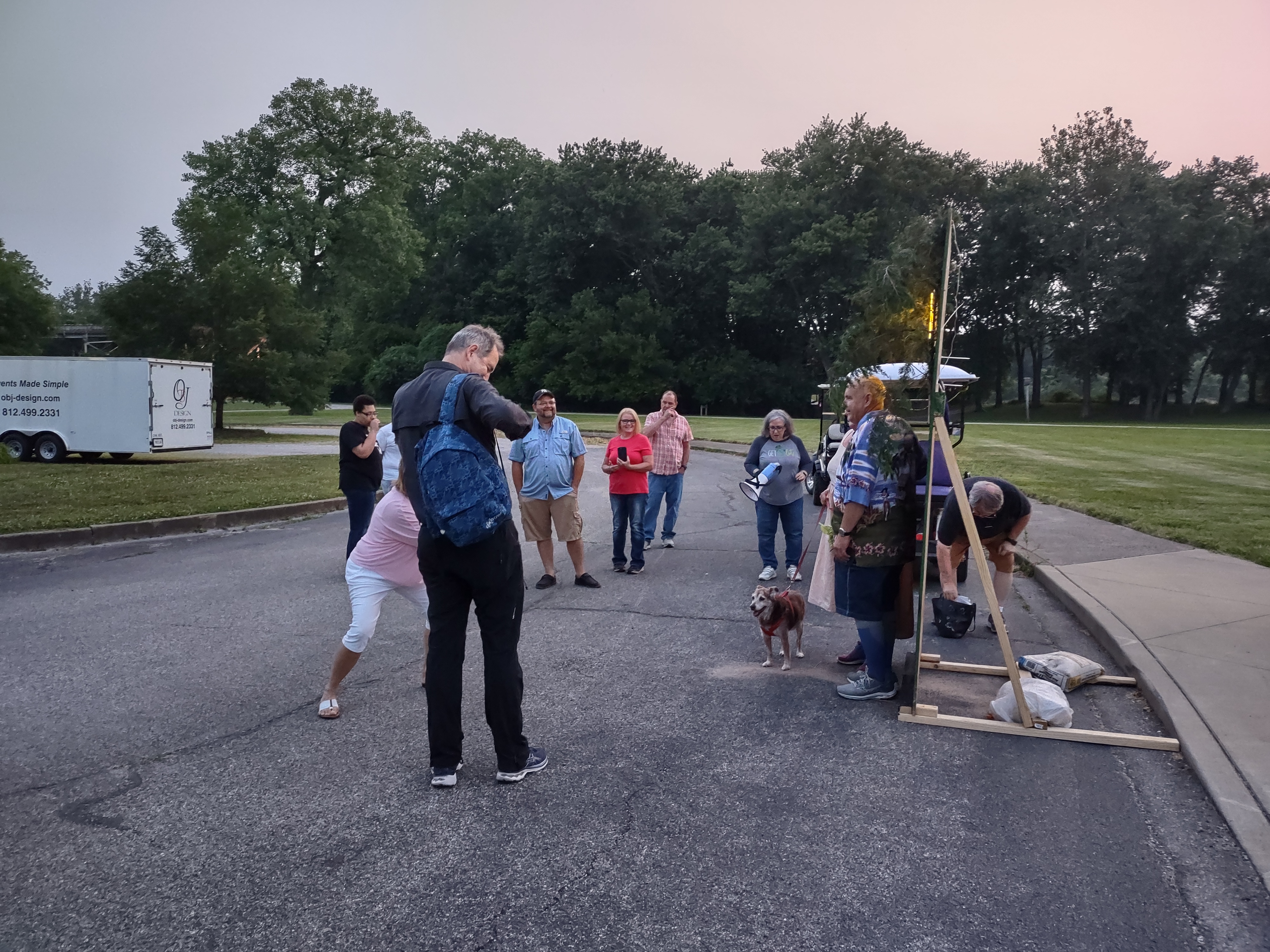 Group gathered around a photo op in the Atheneum parking lot