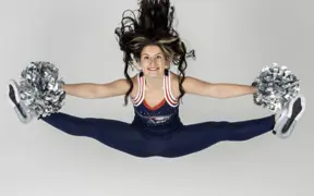 A member of the dance team performs a perfect jump split for Dance Team media day.