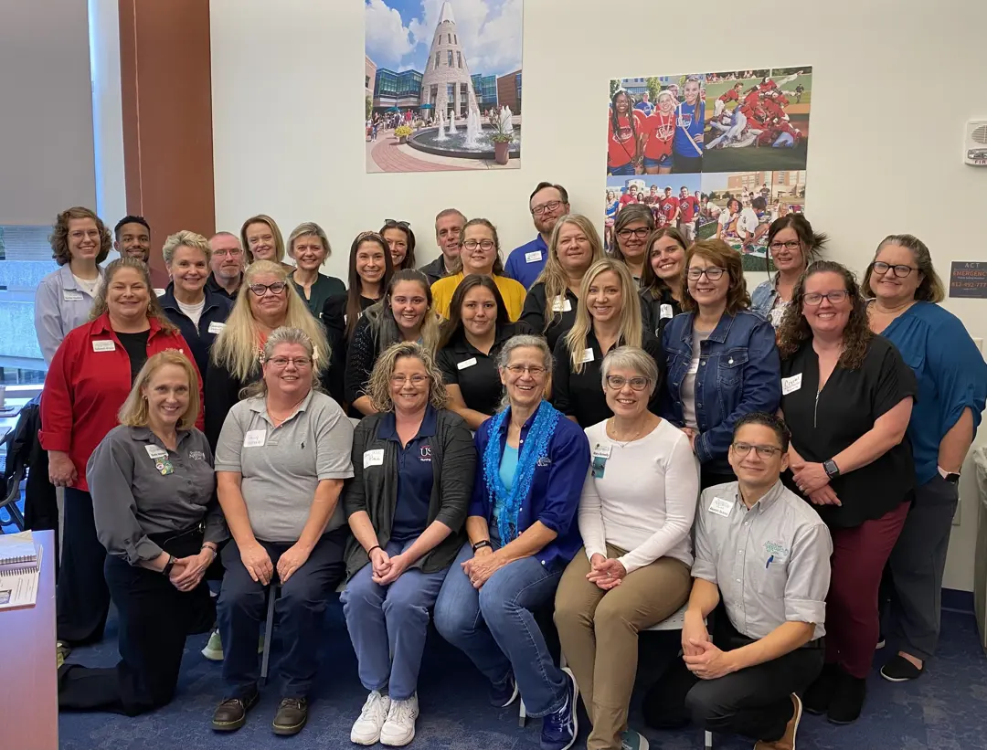 A group photo of Positive Approach to Care® program participants