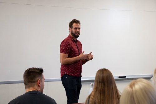 Zac talking to students
