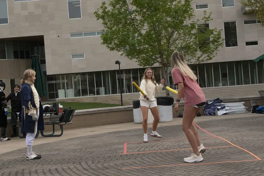 Students practicing fencing.