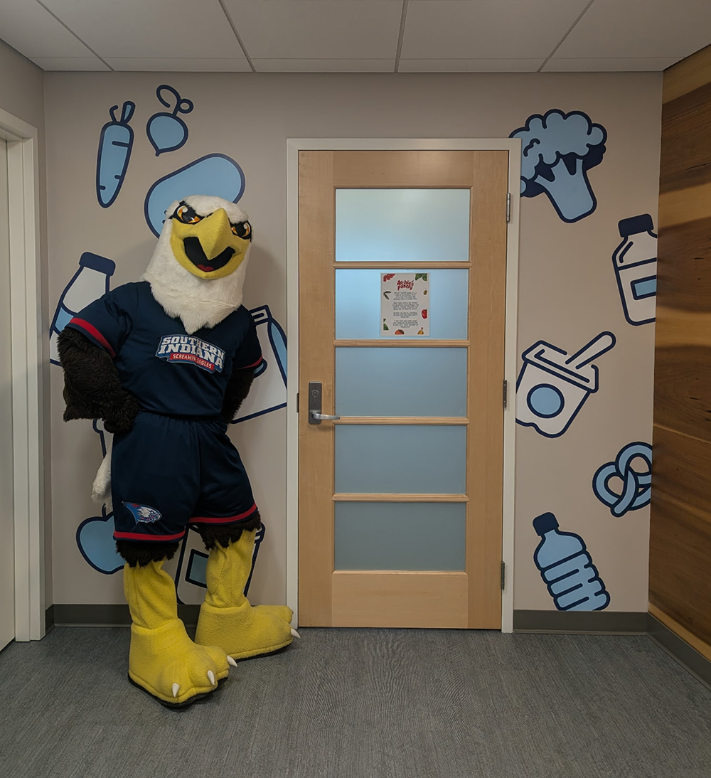 Archie Eagle standing by the Dean of Students Entrance