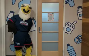 Archie Eagle standing by the Dean of Students Entrance