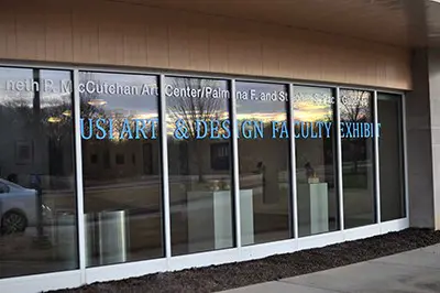 Gallery exterior windows with show text